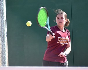 Kamaile Bruce from the Mavs takes a swing and hits the ball back towards her Sunnyside opponent in first singles Wednesday afternoon.