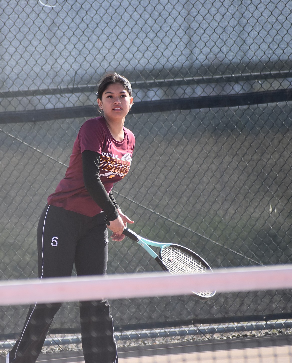 Arianna Martinez from Moses Lake hits the ball back during the second doubles matchup against Sunnyside.