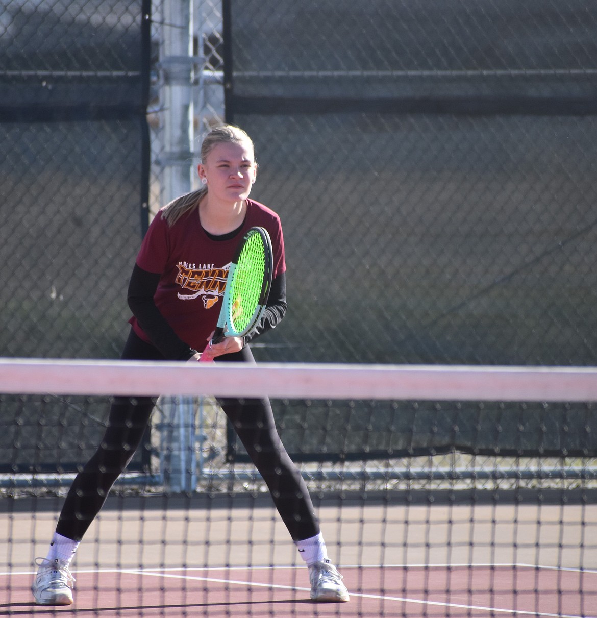 Mavs player Sage Salisbury stands ready on the court as she awaits the serve during Wednesday’s third doubles match.