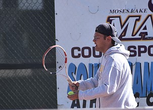 Jacob Duvall from the Mavs prepares to serve during the second singles match Wednesday afternoon against Sunnyside.