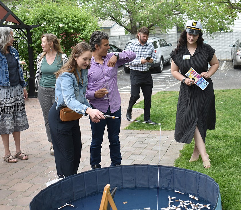 Participants angle for prizes at last year’s Columbia Basin Allied Arts fundraiser auction. This year’s event will be May 2 at the Best Western Plus Lake Front Hotel in Moses Lake.