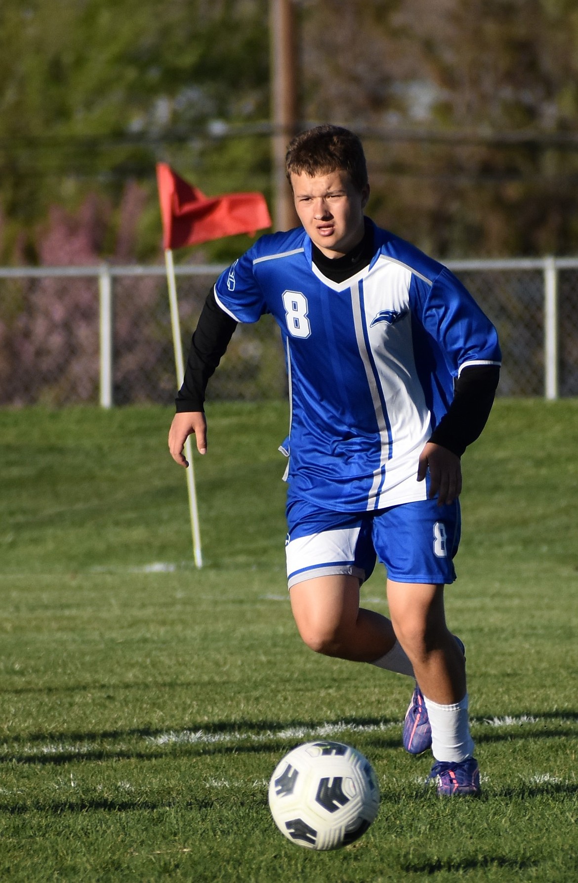 Eagles freshman David Kriuchkov chases down the ball in the middle of the field during Thursday’s game.