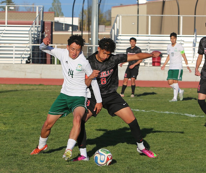 Dominik Plascencia (14) and Johndel Garcia (8) battle for control of the ball Thursday. The Othello Huskies defeated the Quincy Jacks 3-2 in overtime penalties.