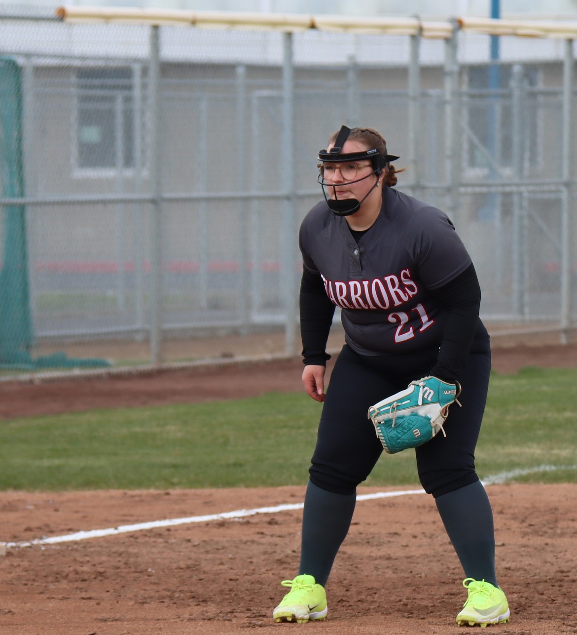 ACH’s Grace Erickson awaits the pitch while guarding third base during a road matchup earlier this season.