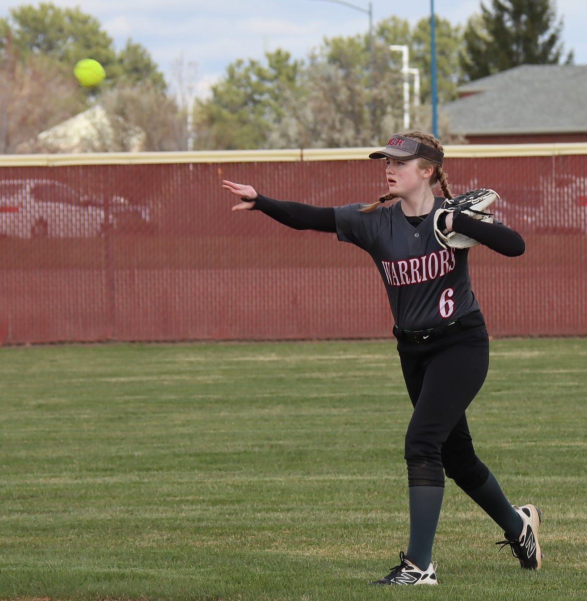Keira Cunningham from ACH throws the ball back toward the diamond at a game earlier in the season.