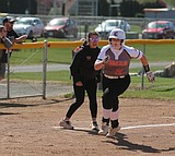 Tigers split doubleheader at home