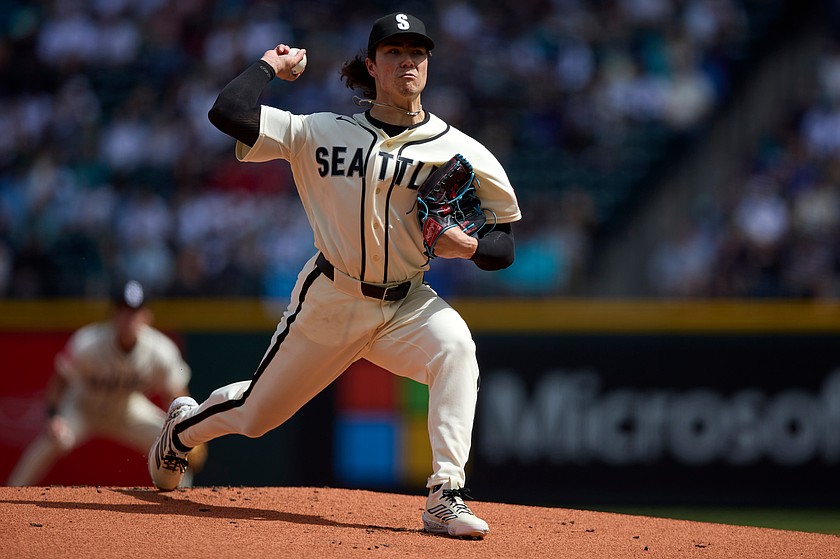 Seattle Mariners starting pitcher Bryan Woo throws against the Texas Rangers during the first inning in a baseball game Sunday, April 19, 2026, in Seattle.