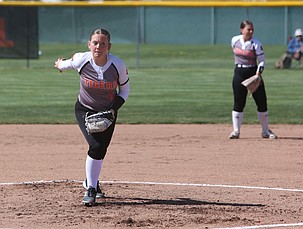The Ephrata Tigers’ Haley Trusty (11) warms up between innings during Saturday’s doubleheader against Prosser.