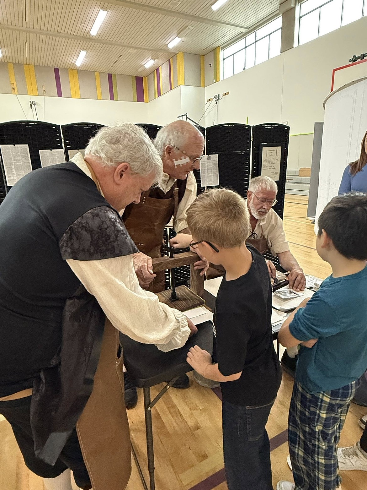 Students learn to print the way Benjamin Franklin did at Pioneer Elementary School, with the Quincy Valley Historical Society’s traveling exhibit “Journey to Philadelphia 1776.”