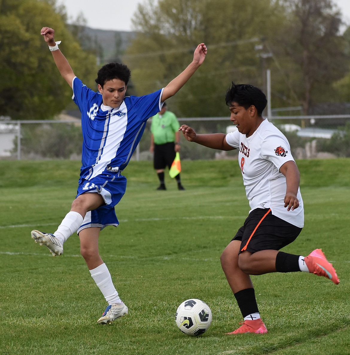Angel Abarca from the Eagles spreads out to block a kick from an Entiat player during Tuesday’s game.