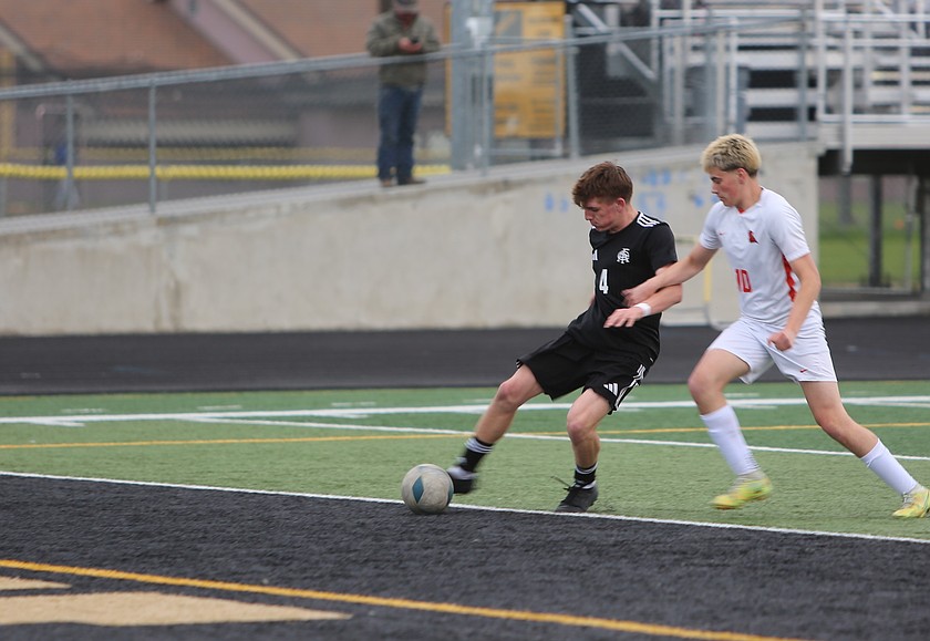The Knights’ Scout Stevenson (4) boots the ball into the net as a Zillah player applies defensive pressure. The Royal Knights defeated Zillah 8-0 Tuesday.