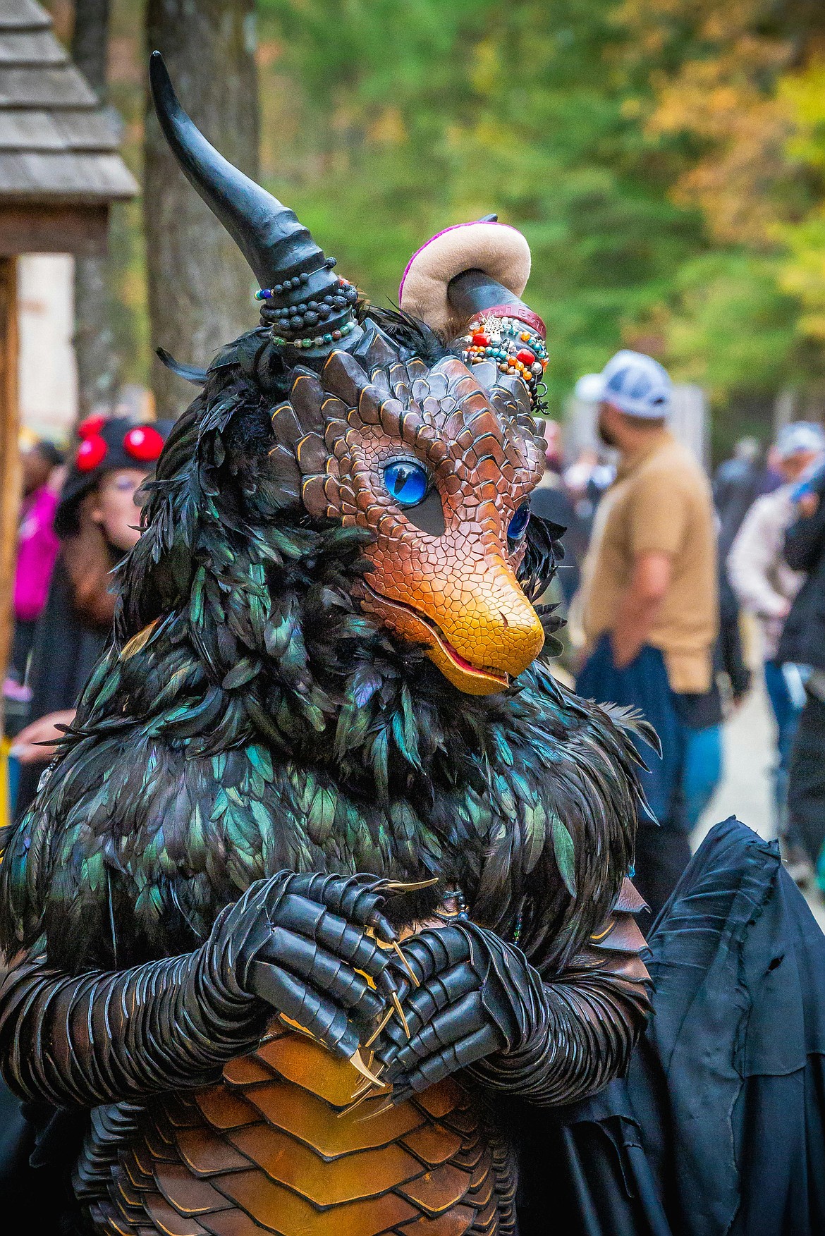 Intricate dragon costume at a 2024 renaissance fair.