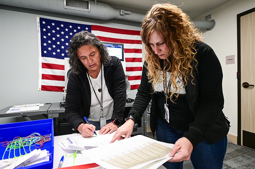 Tammy Bartos, left, and Paula Buff check the results of a batch of test ballots tabulated during a public viewing test for the 2026 Special and School District Election at the Flathead County Election Department in Kalispell on Thursday, April 23. (Casey Kreider/Daily Inter Lake)
