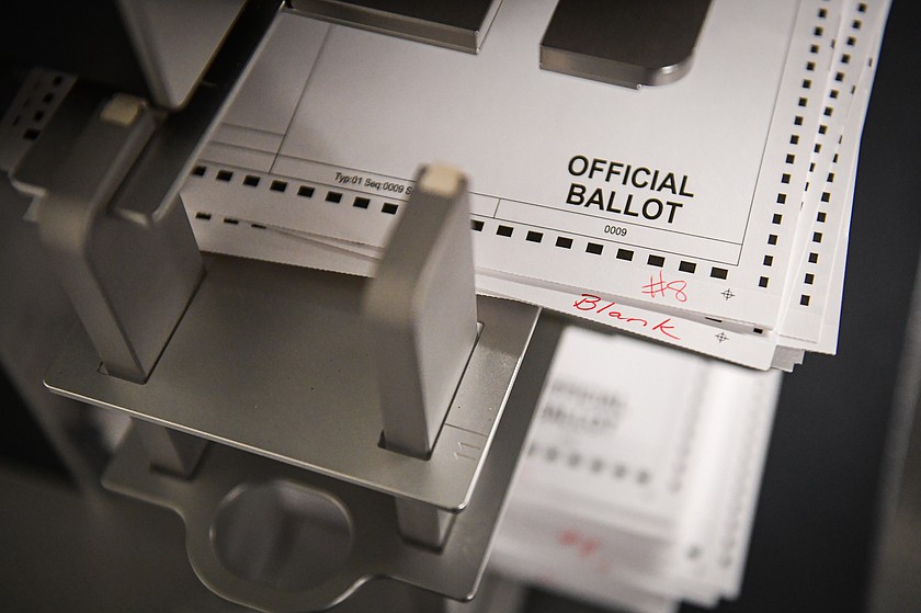 Test ballots are entered into a vote tabulator during a a public viewing test for the 2026 Special and School District Election at the Flathead County Election Department in Kalispell on Thursday, April 23. (Casey Kreider/Daily Inter Lake)