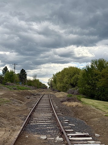 Long-disused railroad tracks stretch under a cloudy sky at Neppel Landing in Moses Lake Thursday.