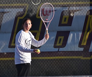 Hadley Whittall from the Mavs prepares her serve during a previous home meet this season.