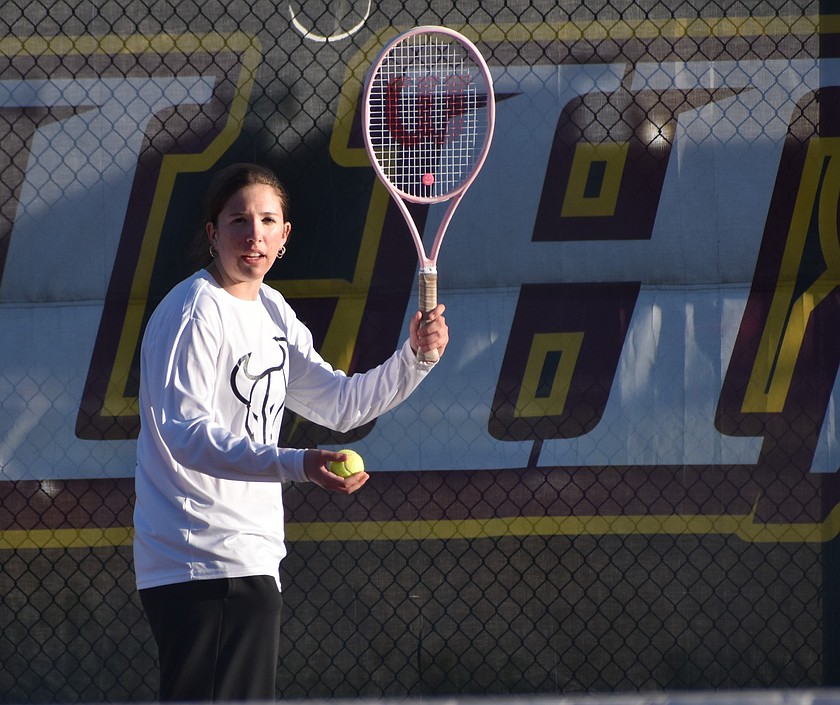 Hadley Whittall from the Mavs prepares her serve during a previous home meet this season.