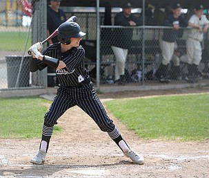 Haydon Boyd (4) steps into his swing while at bat for the Almira/Coulee-Hartline Warriors during their game against the Royal Knights earlier this season. Boyd, a freshman, put in a strong performance on the pitching mound as the Warriors swept Wilbur-Creston-Keller Tuesday in a doubleheader.
