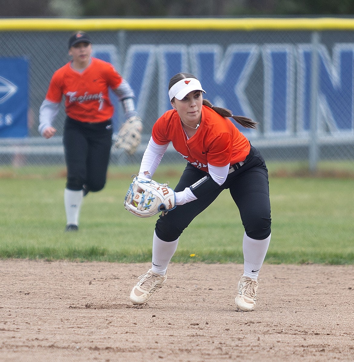 Courtesy photo
Post Falls junior second baseman Natalie Stroud (4) fields a ground ball during the first game of a doubleheader Thursday at Larry Schwenke Field in Coeur d’Alene. Outfielder Paityn Froman (7) backs up Stroud on the play.