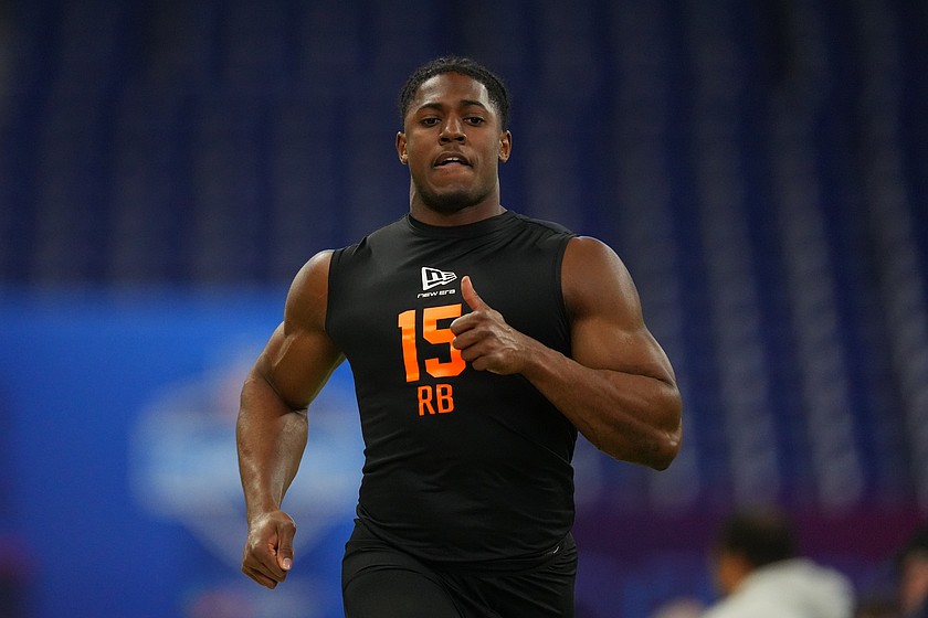 FILE - Notre Dame running back Jadarian Price (15) runs the 40-yard dash at the NFL football scouting combine in Indianapolis, on Feb. 28, 2026.