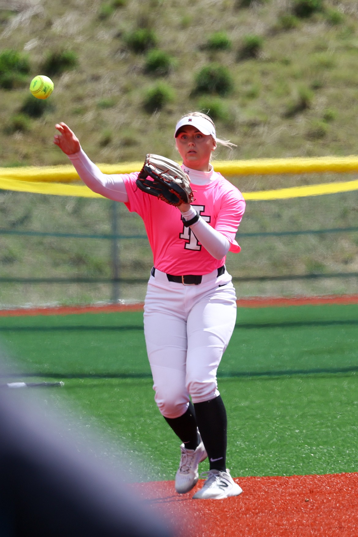 KYLE DISHAW PHOTOGRAPHY
North Idaho College freshman centerfielder Aspen Roberts throws the ball back into the infield during the first game of a Scenic West Athletic Conference doubleheader against Utah State-Eastern at the Marimn Health Coeur Center in Worley on Friday.