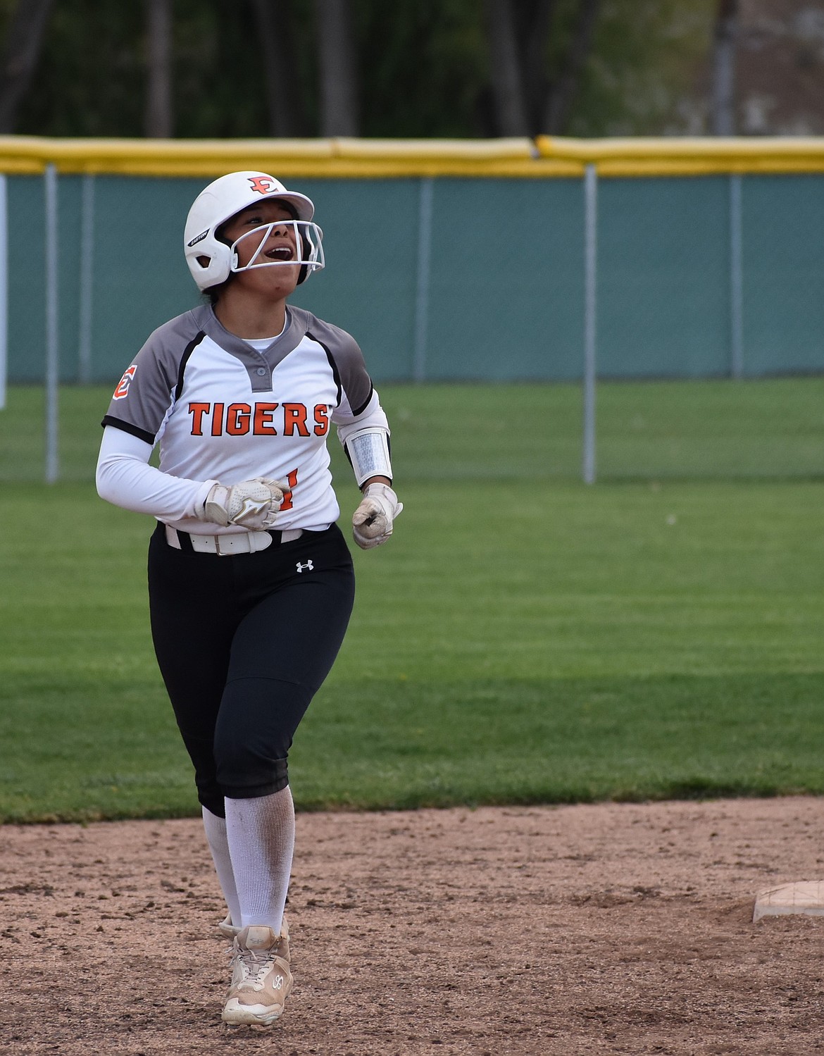 Tigers player Cami Martinez cheers as she rounds the bases after hitting a home run in game two against the Huskies.