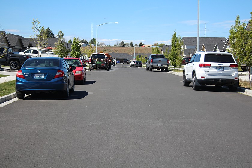 Cars line both sides of a Moses Lake street. Parking was a big part of a Moses Lake City Council discussion on street widths for new developments.