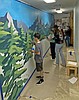 Student artists brighten entry to library with mural
