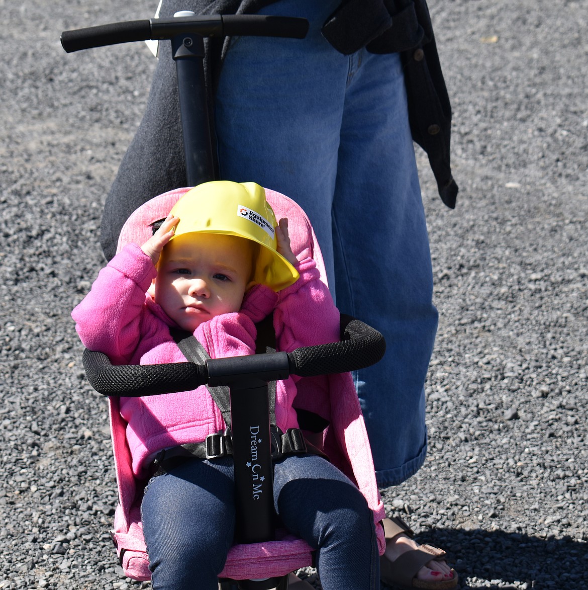 Blaine Canales, 18 months, has her own fire fighter helmet as a souvenir of Touch a Truck Saturday in Moses Lake.