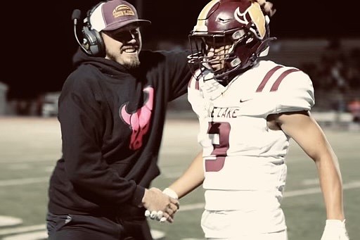 Moses Lake Mavericks Head Football Coach Kyler Haneberg, left, celebrates with former player Calin Dameron, right. Haneberg was named the new head coach Friday by Athletic Director Loren Sandhop.