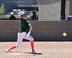 The Jacks’ Diana Herrera Virrueta, in green, takes a swing at the ball during their game against Ephrata on Saturday.