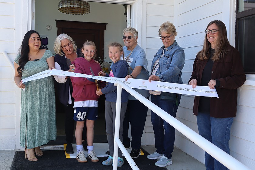Brylee Watkins, left front, and Hallie Uebelacker, right front, cut the ribbon on Opening Day 2026 at the Othello Museum. Holding the ribbon are, from left, Greater Othello Chamber of Commerce Manager Jackie Wilhelm and museum volunteers Molly Popchock, Barbara Caylor, Shirley McCullough and Rebecca Mohs.