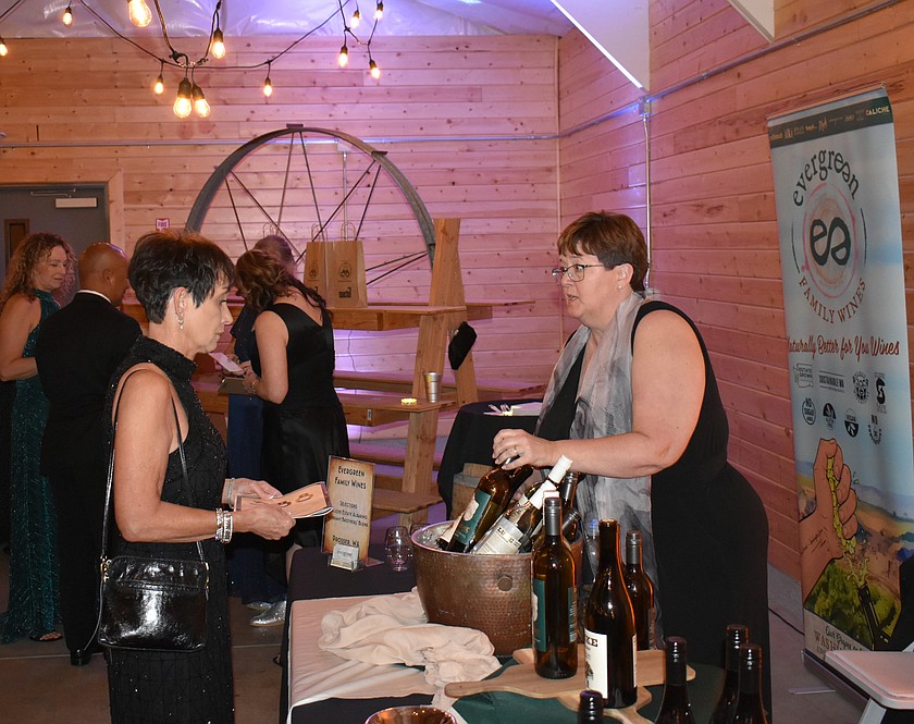 Karen Ballew, right, of Evergreen Family Wines talks with Melody Jenson at Bourbon & Bowties April 24.