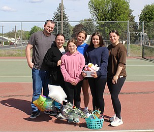Tanya Zubritskiy from the Eagles stands with her family who brought her a variety of baskets with treats to honor her final home match as a senior.