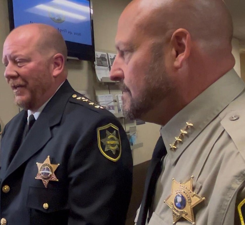 Spokane County Sheriff John Nowels, left, and Stevens County Sheriff Brad Manke, react following the judge's ruling to temporarily block parts of SB 5974, the new sheriff decertification law from taking effect.