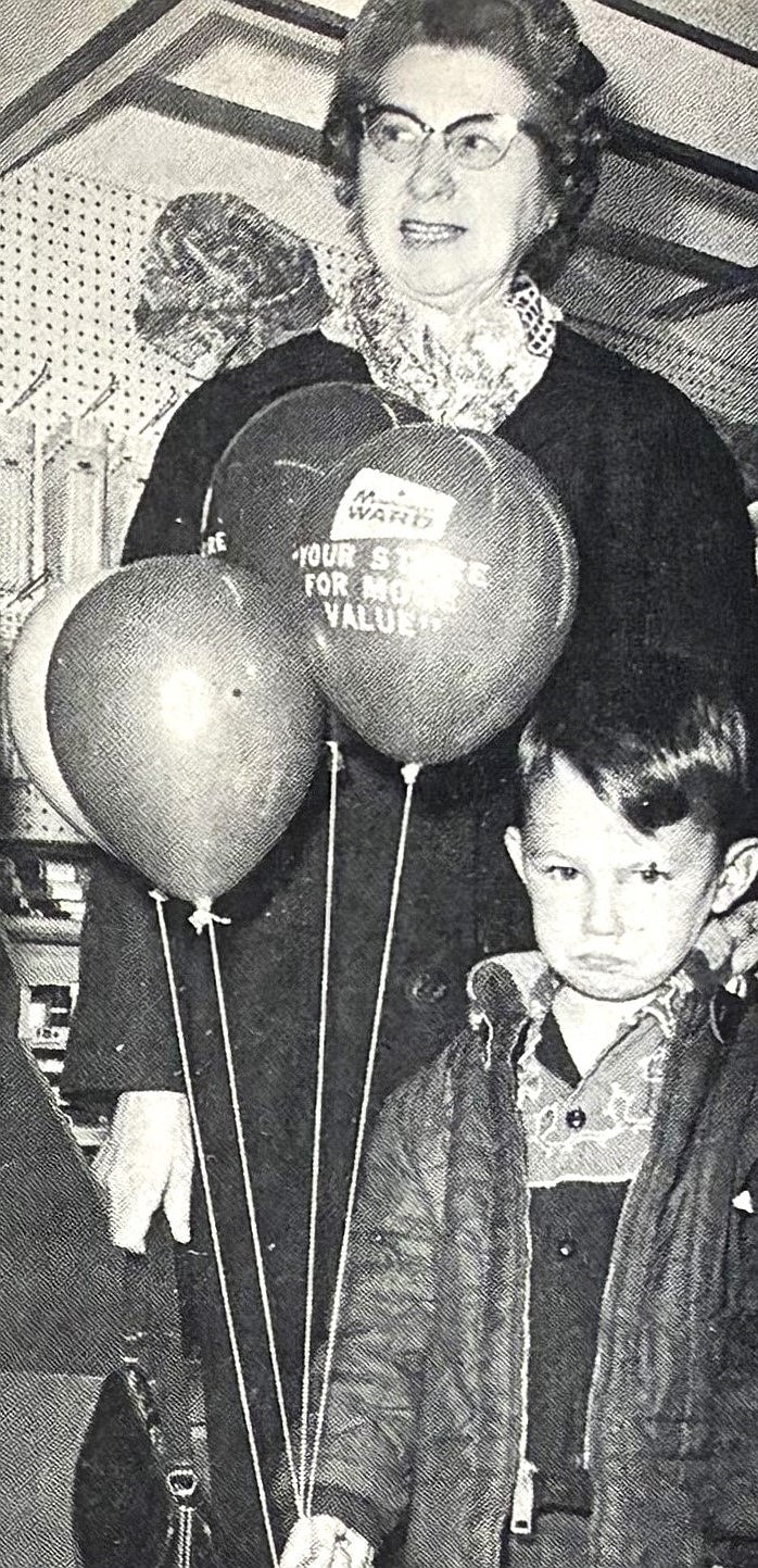 Greg Mills reunites with his grandmother, Mrs. K. Wills, after getting lost during the 1966 grand opening of the Montgomery Ward store.