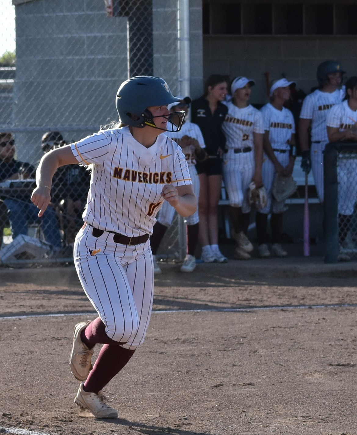 Samantha Kling, a senior from Moses Lake, sprints toward first base.
