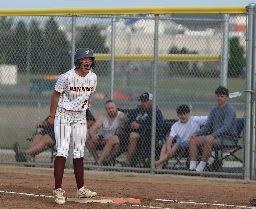 A fired up Addi Reffet (21), who returned Friday from a previously suffered broken lower fibula, yells back to the dugout after a big play against West Valley. The Mavericks split a doubleheader with the Rams Friday.