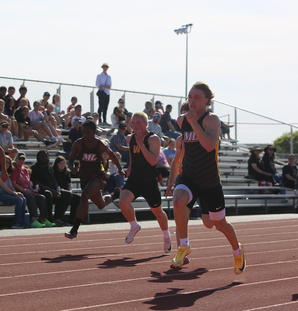 Brady Jay breaks ahead of the pack during the Mavericks 100-meter dash. Jay finished in first place with a time of 10.94.