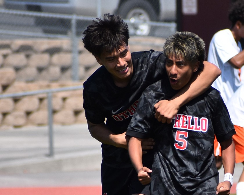 Huskies senior Luis Farias embraces sophomore Samuel Marroquin after Marroquin shot the game winning goal in overtime against Ephrata during the first round of districts.