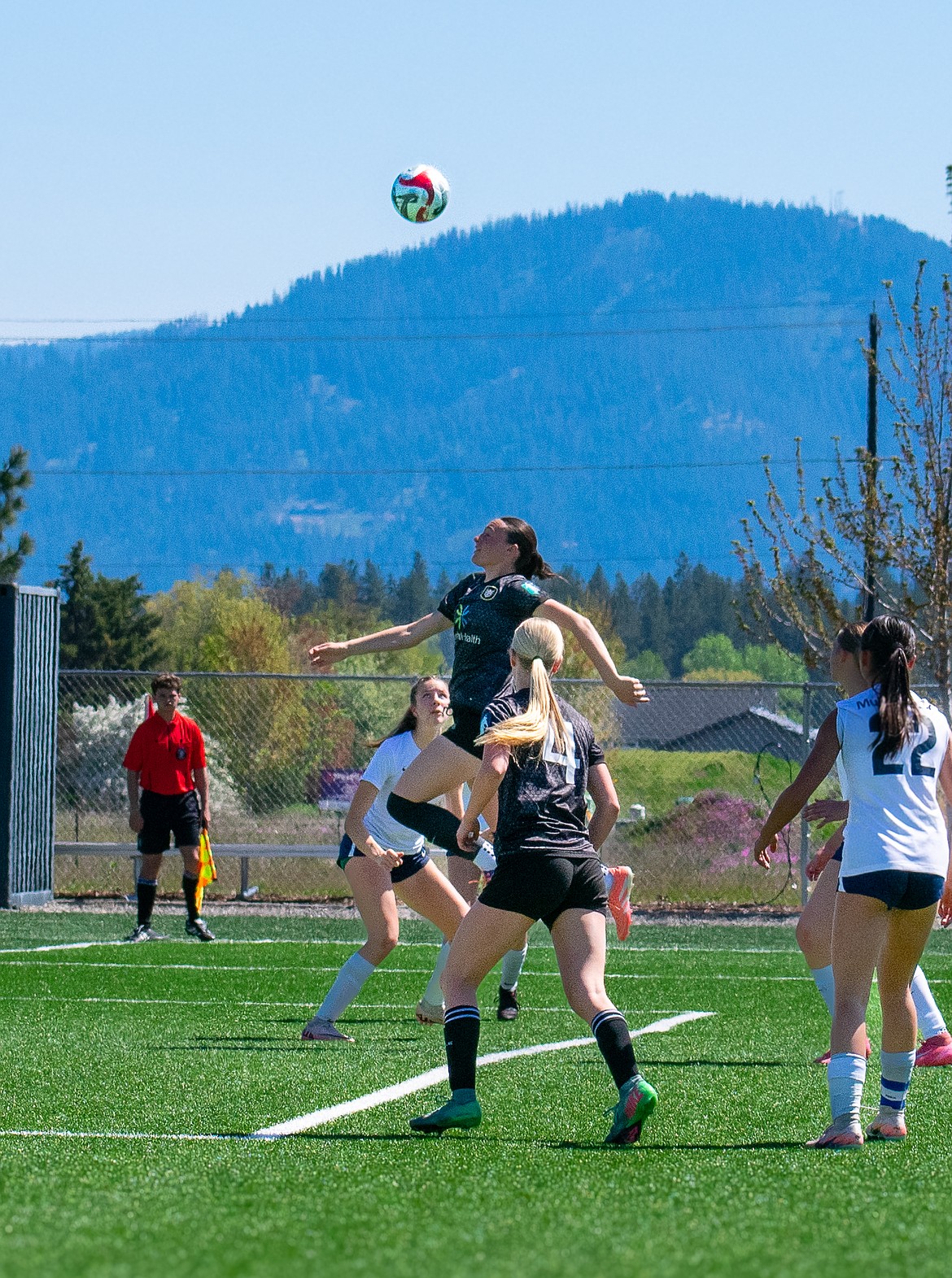 Photo by KARI HYNES
The Sting SC G2011 Academy girls soccer team picked up two wins over the weekend. In their first game against WW Surf, Brightyn Gatten scored three goals, including one on a penalty kick. Payton Brennan added two goals, and Presley Moreau finished with two goals and an assist. The Sting followed with another win against Seattle Reign. Presley Moreau recorded three goals, while Elle Sousley added two. Hailey Hayes and Brightyn Gatten each scored once, with Gatten also contributing an assist. Defensively, Constance Ovendale earned a clean sheet. The team will wrap up their GA Aspire league schedule this week and will also compete in the Bill Eisenwinter Hot Shot Tournament in Coeur d’Alene. Pictured is Elle Sousley, rising for a header.