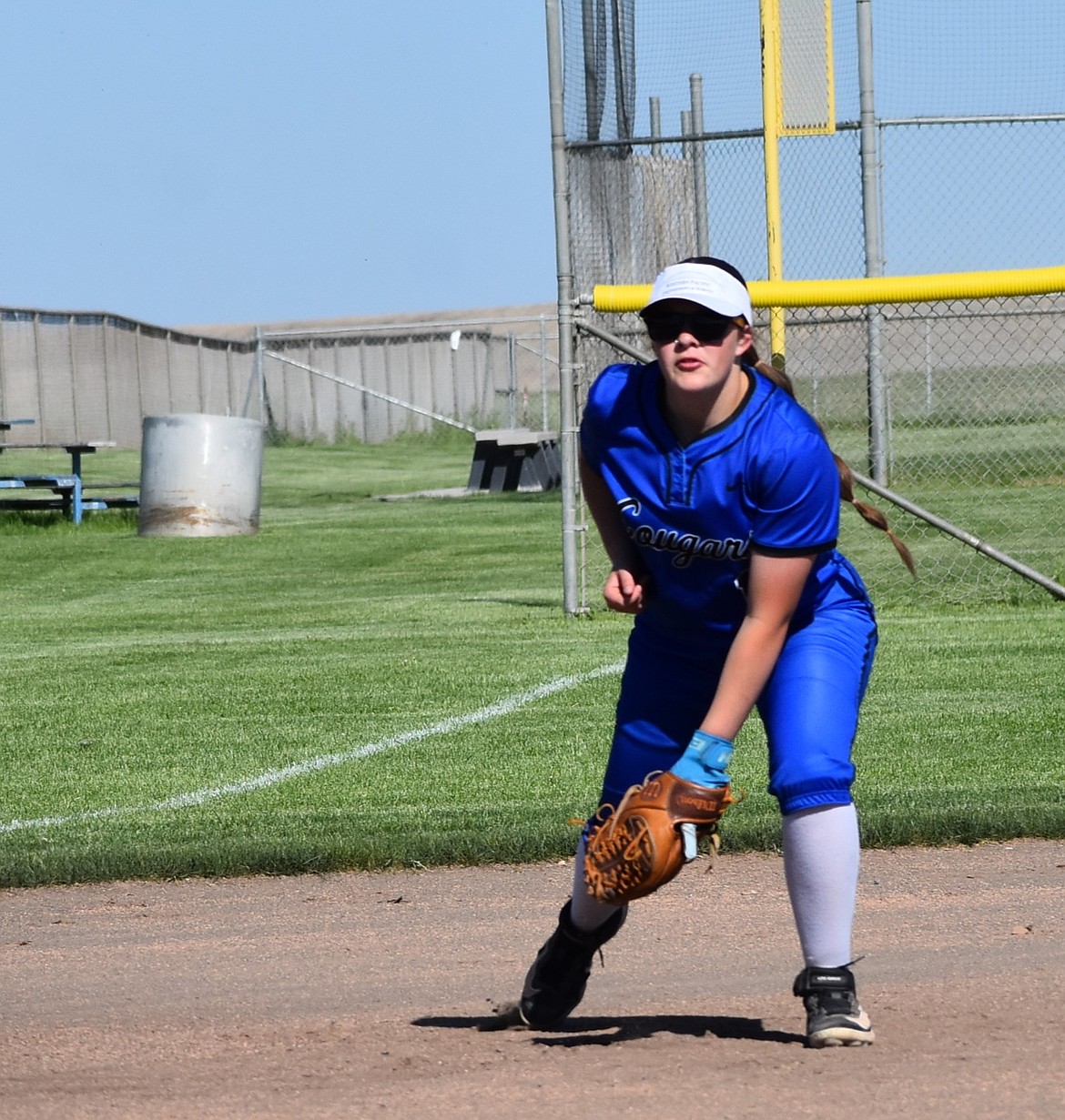 Lindsey Grubb from the Cougars stands ready near third base as a Goldendale player steps up to bat Tuesday afternoon.