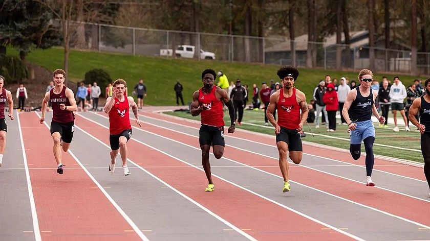 Three Eagles runners sprint across the track over the weekend in the final regular season meet of the year.