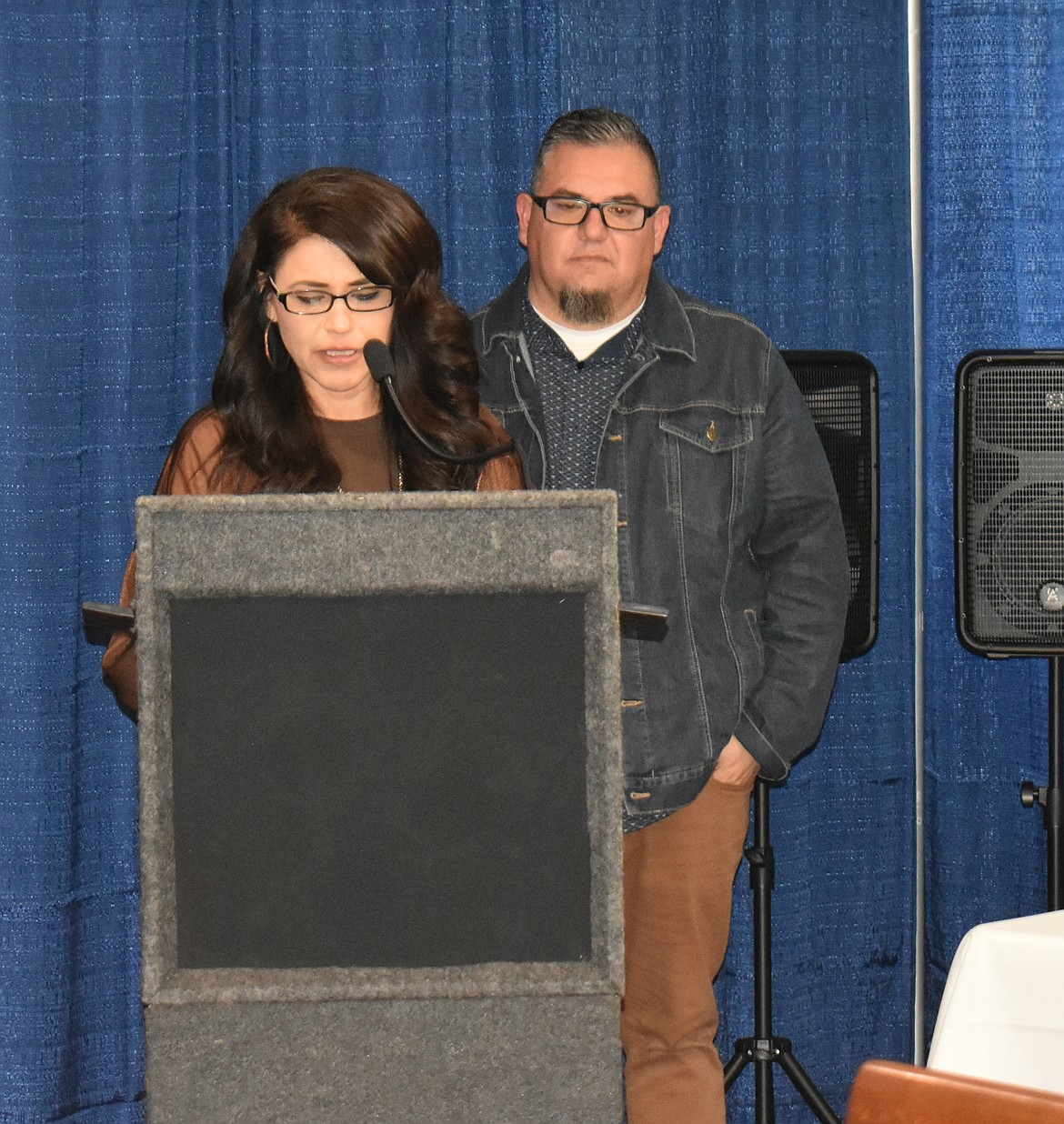 Pastors Mary, left, and Mike Alvarado of Restore City Church read from the Bible and pray for the nation at the Mayor’s Prayer Breakfast Thursday.