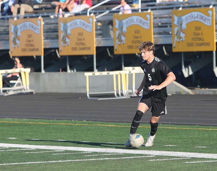 The Royal Knights’ Anderson Brown (5) dances on the ball during their district tournament game against Oroville on Tuesday. Royal defeated Oroville 6-0 to advance to the quarterfinals.
