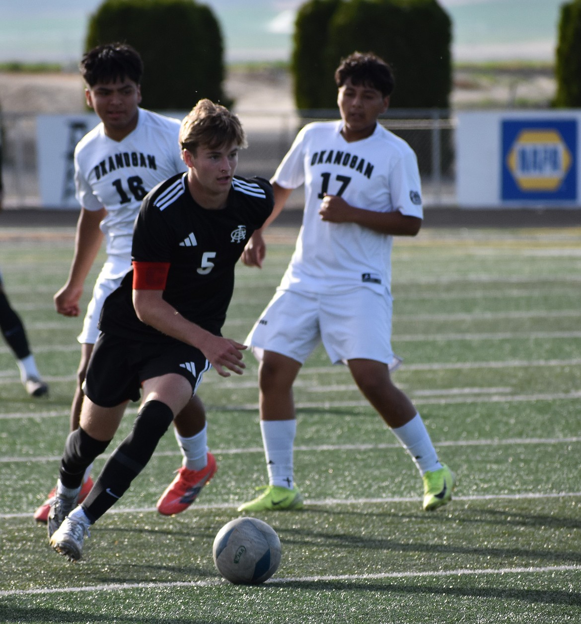 Anderson Brown, a senior from the Knights, pushes the ball down the field in Thursday’s game against Okanogan.