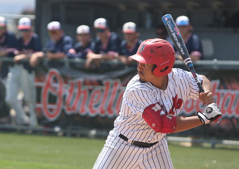 Xzyyvn Martinez (21) eyes the pitcher before his next throw. The Othello Huskies suffered a 5-1 loss to Ellensburg Bulldogs at home in the District 5 2A semifinals.