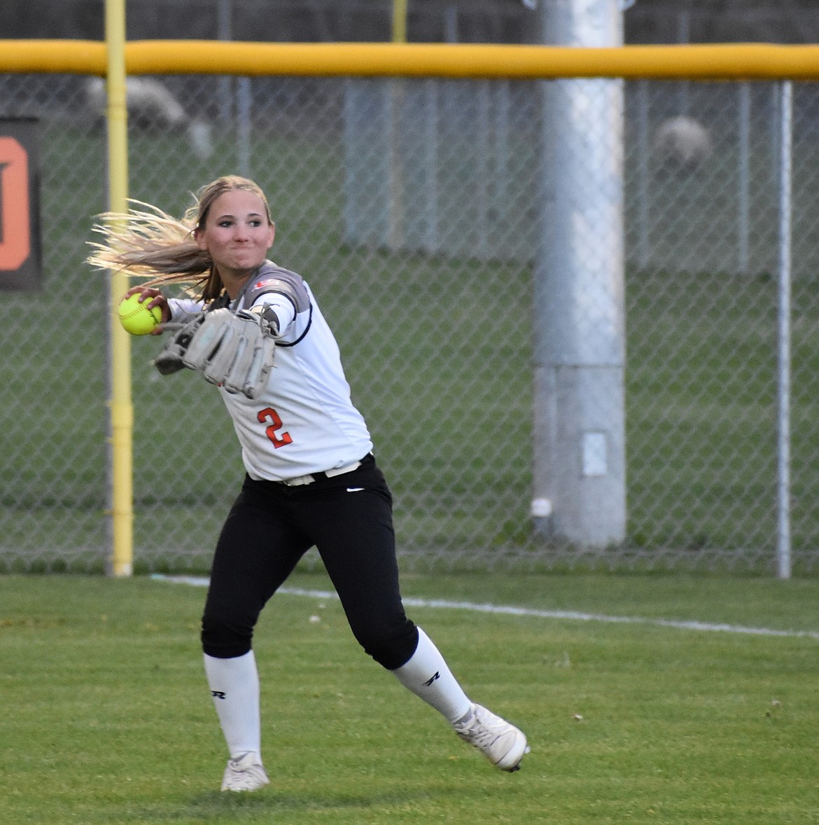 Tigers player Brynnie Leonard throws the ball back toward the mound in a previous game this season.