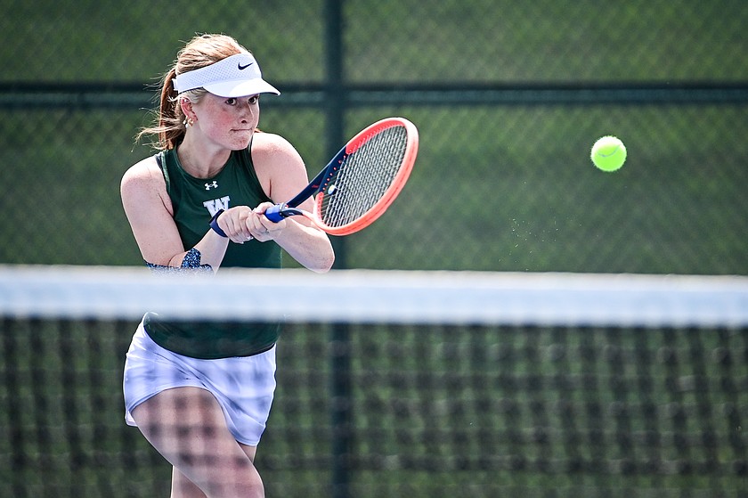 Whitefish's Liesl Brust follows through on a return in singles match against Flathead's Allie Goff at Flathead Valley Community College on Tuesday, May 12. (Casey Kreider/Daily Inter Lake)