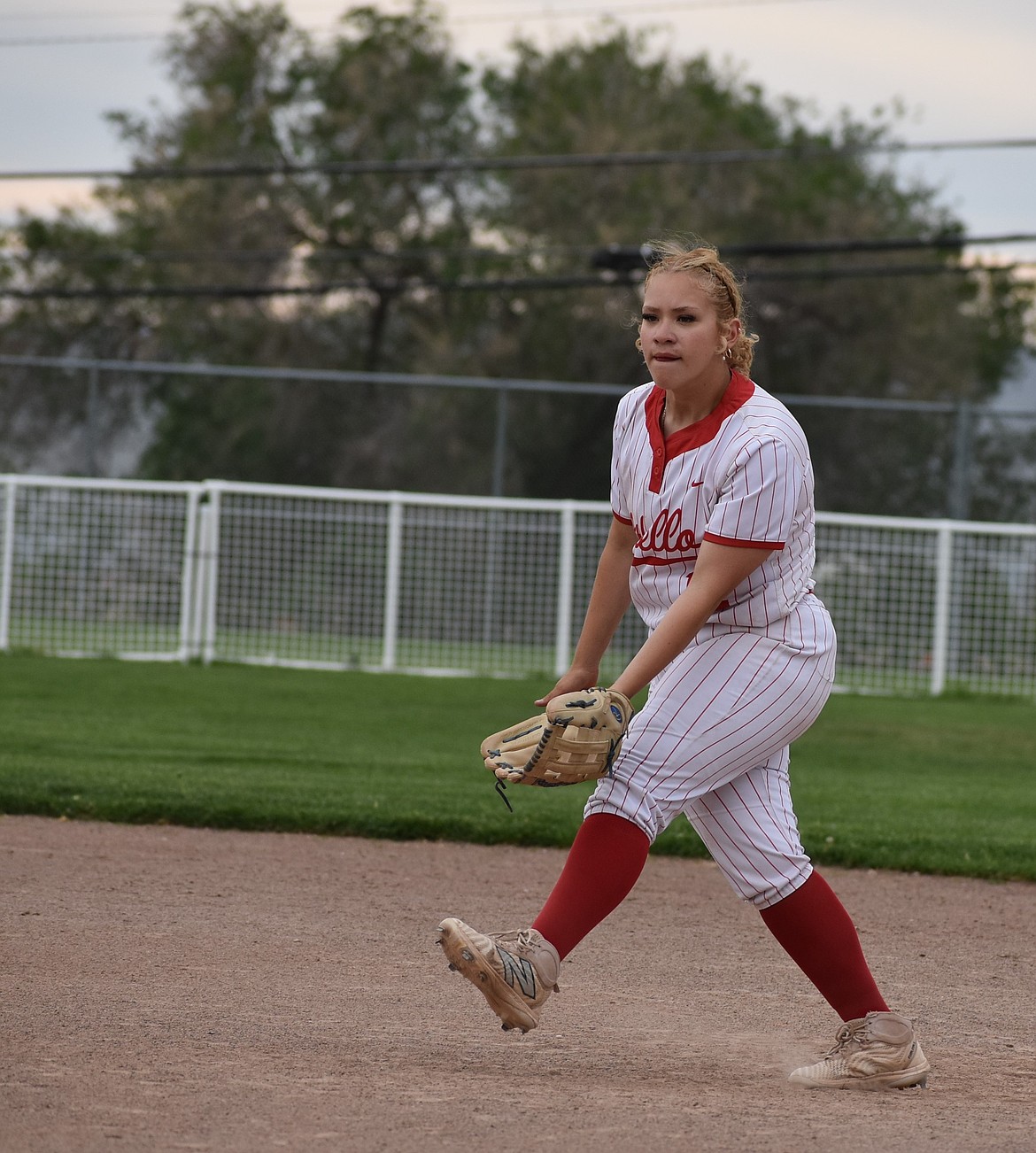 Huskies junior Chita Lara gets ready to defend first base in the team’s postseason home game against Toppenish.